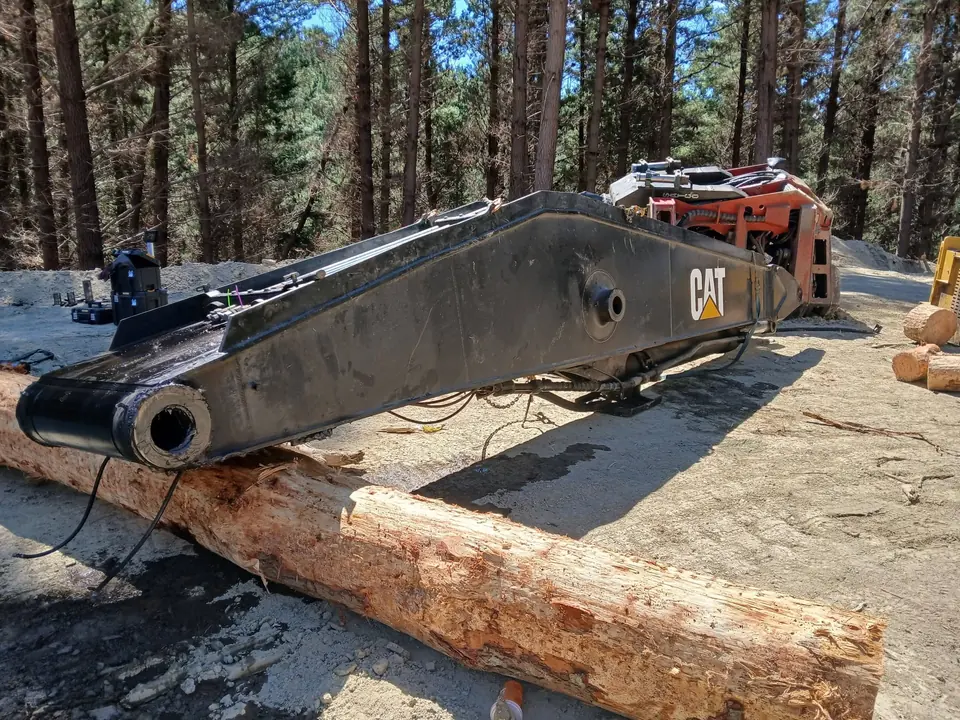 Main boom removed from the machine and laid out on timber blocks