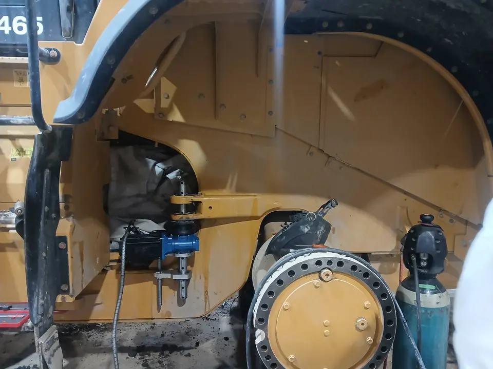 Drive assembly being drawn out of a wheel loader