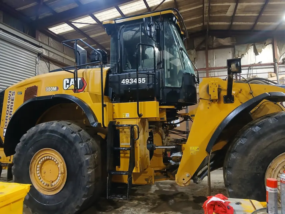 Wheel loader pulled into the workshop for servicing