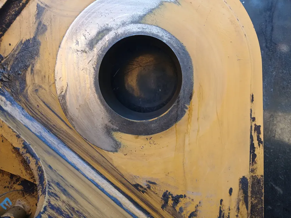 Machined bore in the side of a machine boom