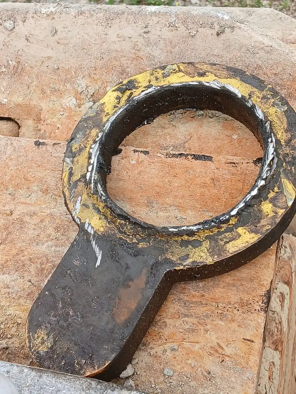 Worn bush pressed out and set down beside the job