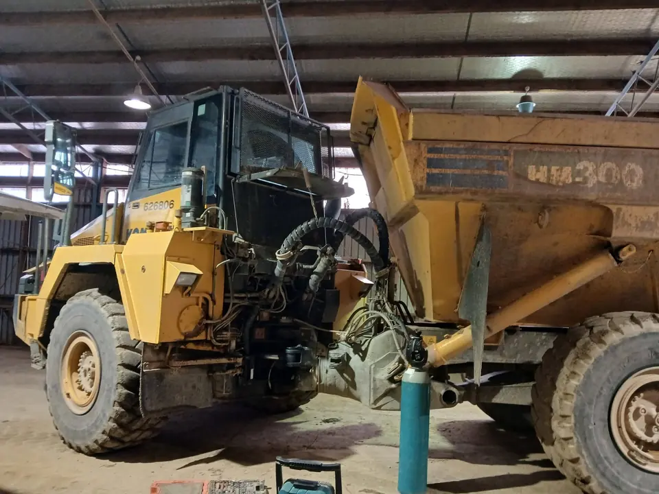 Articulated dump truck in a workshop with work under way