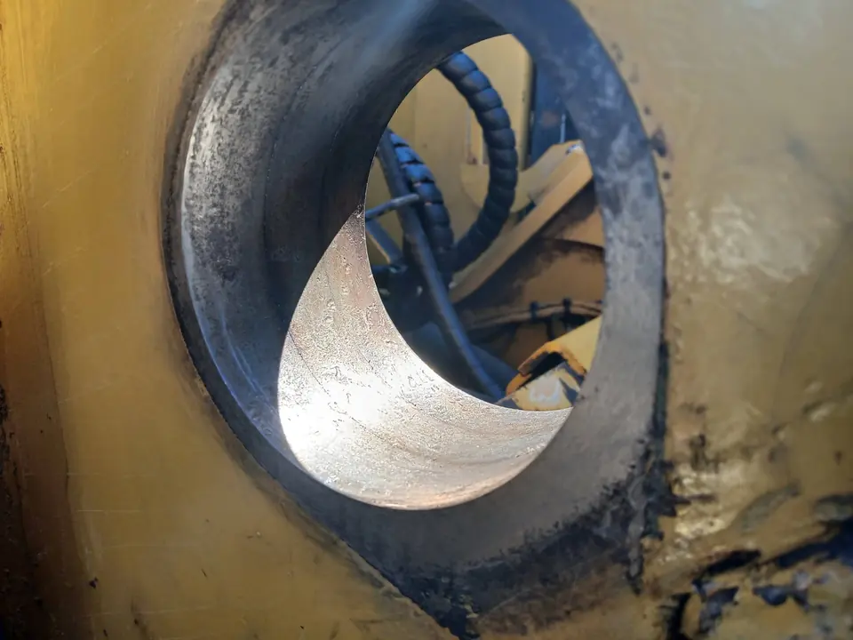 Weld laid in a spiral through a boom bore ready for boring